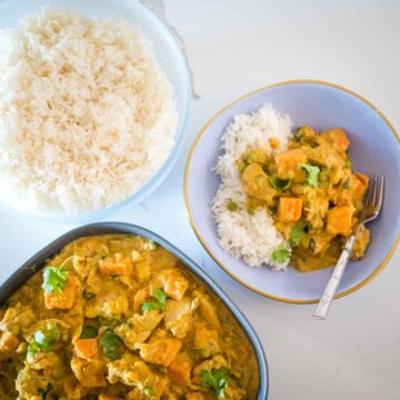 bowl of chicken and coconut curry with sweet potato with rice