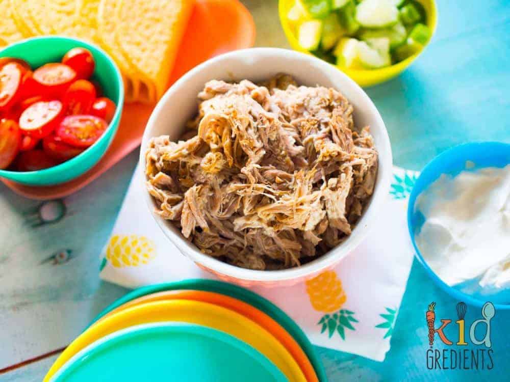 pineapple and lime pulled pork, one of the easiest and tastiest recipes you can make in a slow cooker. Perfect for summer dinners and lunches!