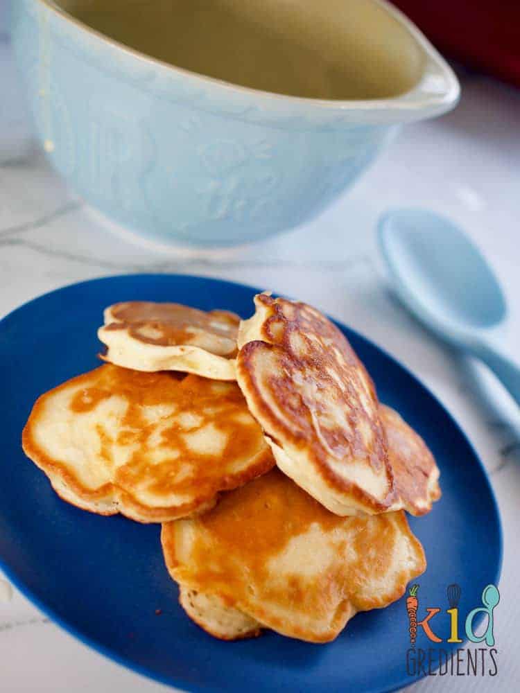 Pineapple Pikelets on a blue plate with a blue bowl behind