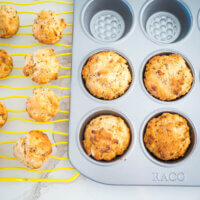 muffins in a pan and on a wire rack