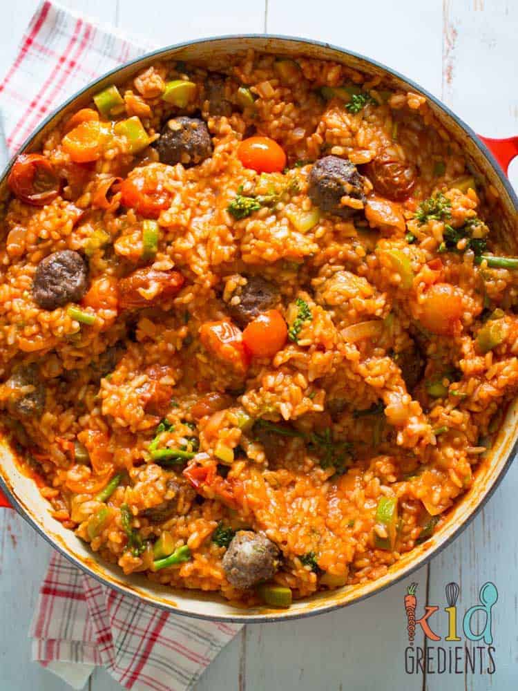 Baked tomato and mini meatball risotto, a kid friendly mid week meal! Risotto with no stirring! Yummy and filled with veggies #kidsfood #familyfood #risotto #baked #meatballs