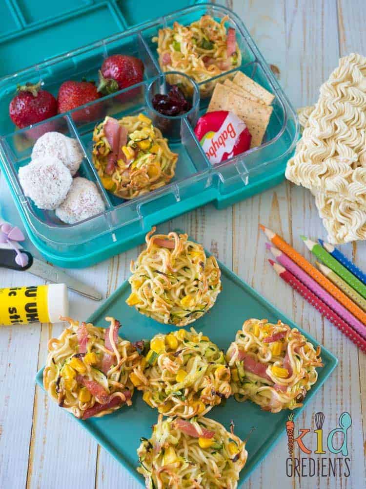 noodle and veggie frittatas on a plate and in a lunchbox