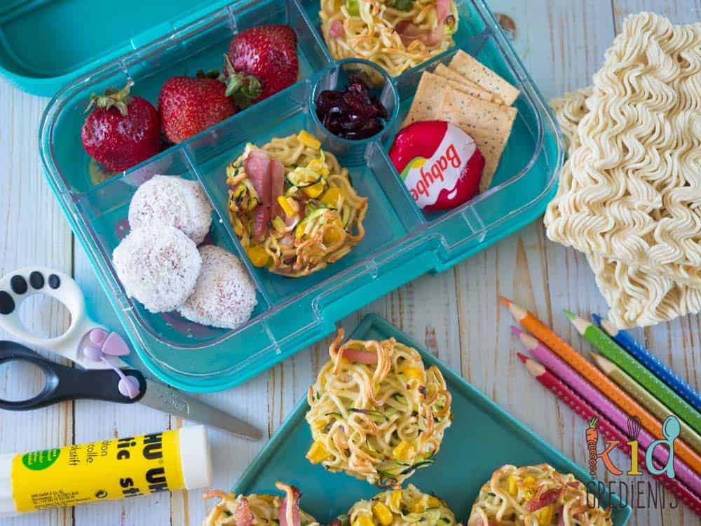 noodle and veggie frittatas in a yumbox and on a plate