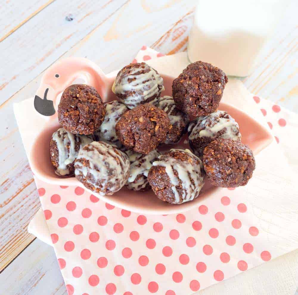 nut free chocolate bliss balls on a flamingo plate
