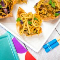 chicken and veggie noodles in baked wonton cups