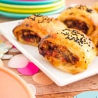 cheese and bacon sausage rolls on a plate