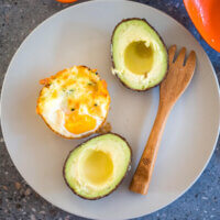 egg cup in a plate with avocado and a spoon
