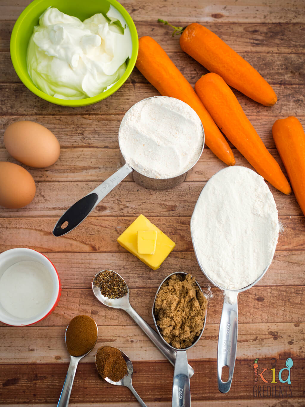 ingredients, flour, eggs, sugar, carrots, butter, spices and yoghurt