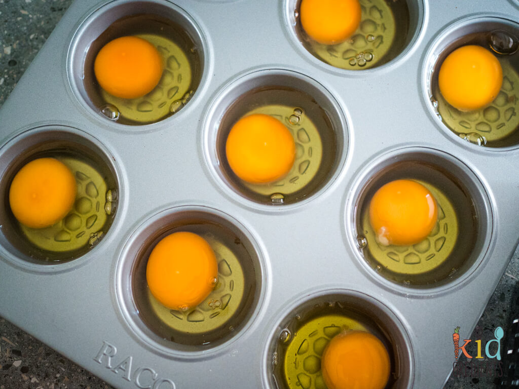 eggs cracked into muffin tin