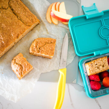 amazing food processor apple cake, cut into squares and some in a lunchbox