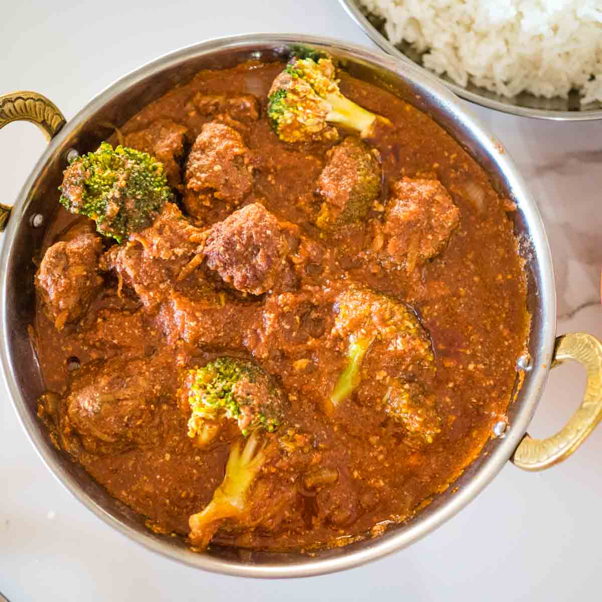 beef mince curry meatballs in a bowl