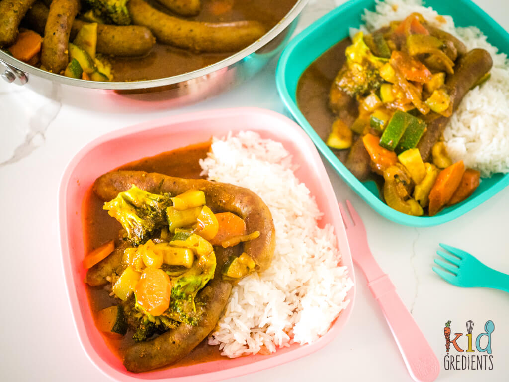 curried sausages on kids plates with rice