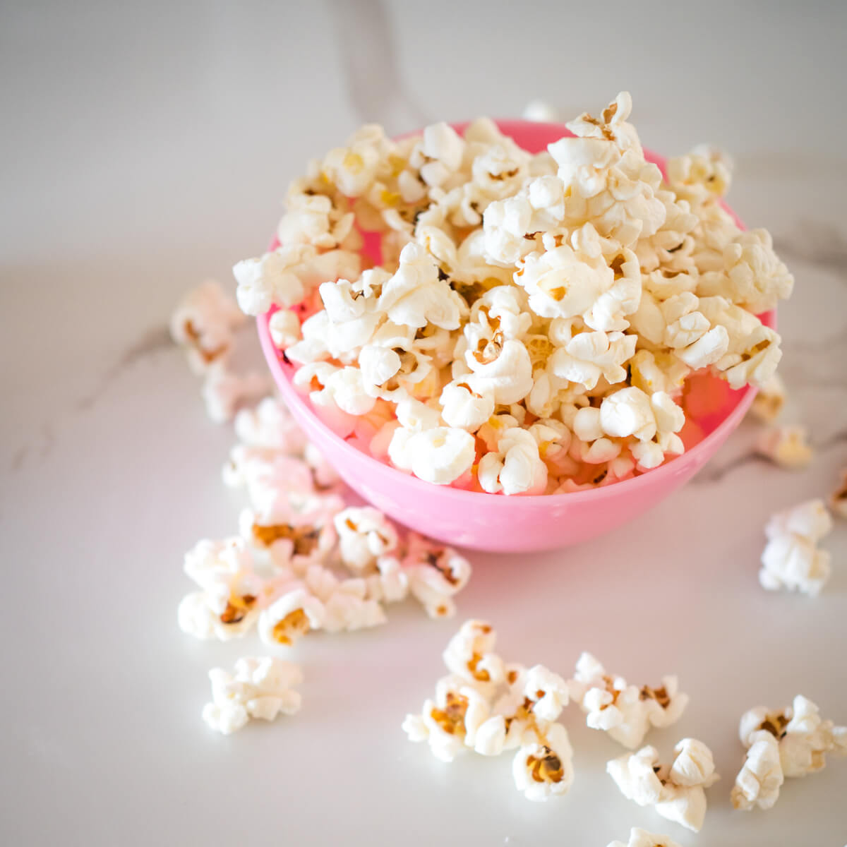 2 ingredient homemade popcorn spilling out of a bowl