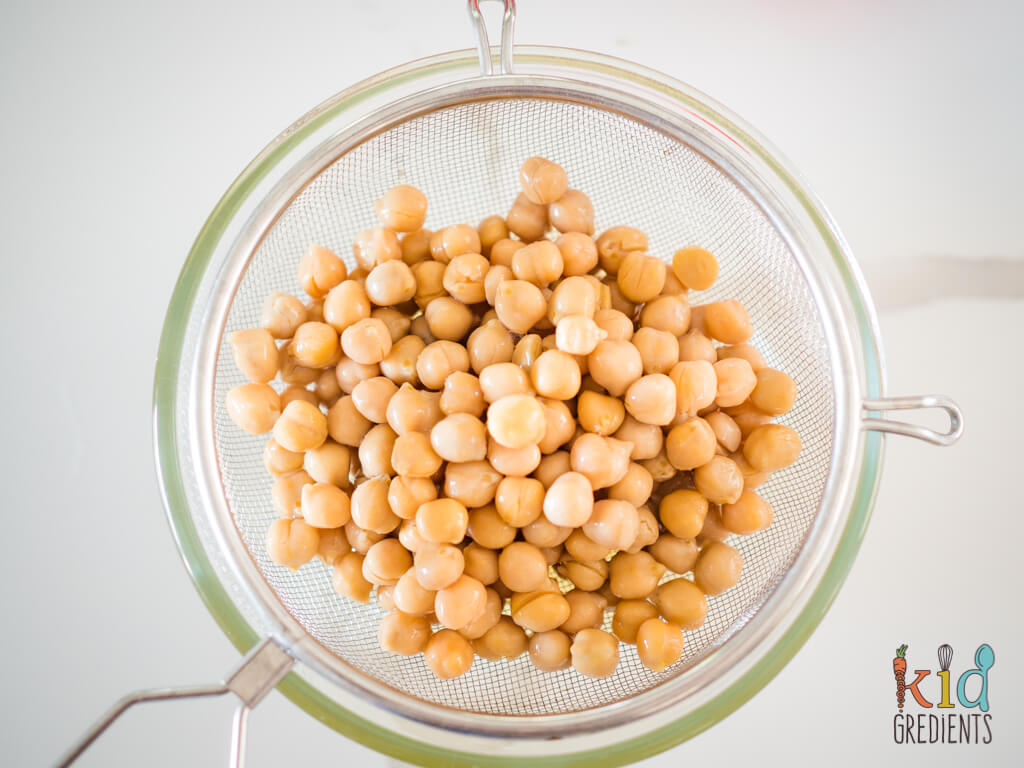 chickpeas draining over a bowl