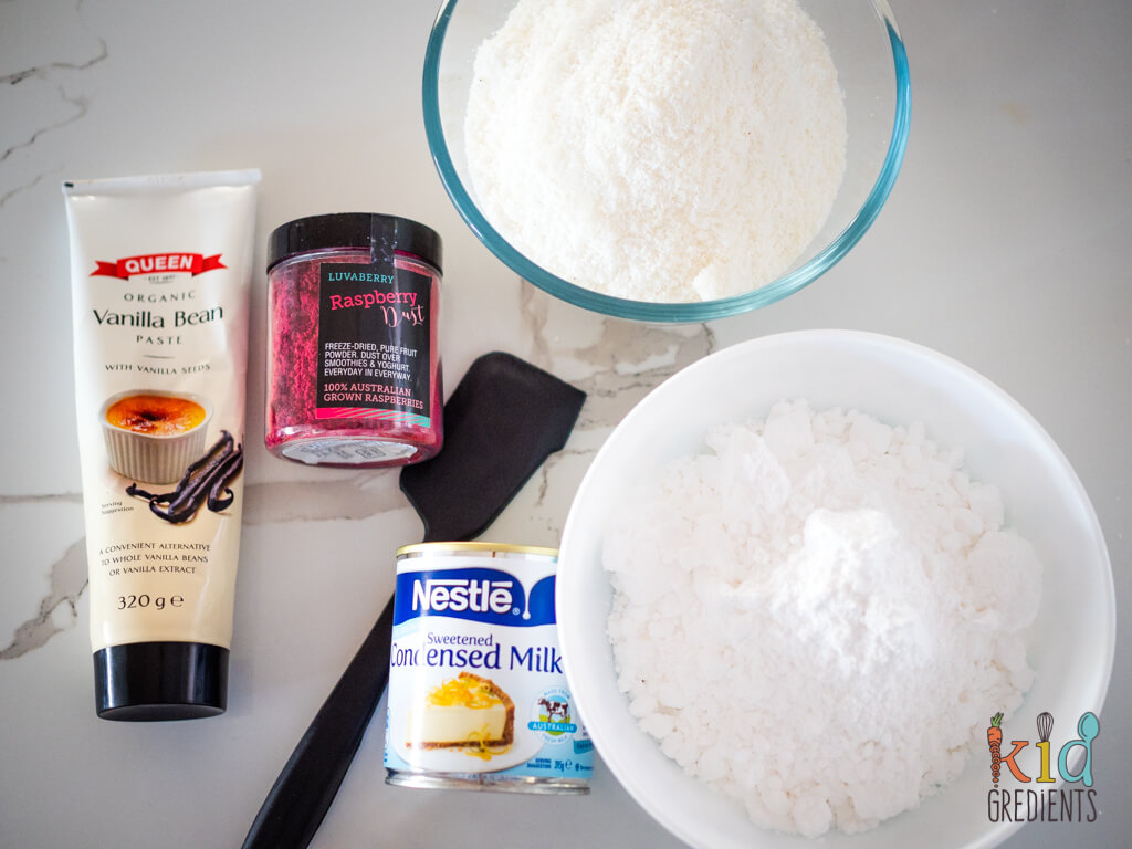 ingredients for coconut slice, desiccated coconut, icing sugar, condensed milk, vanilla paste and raspberry dust