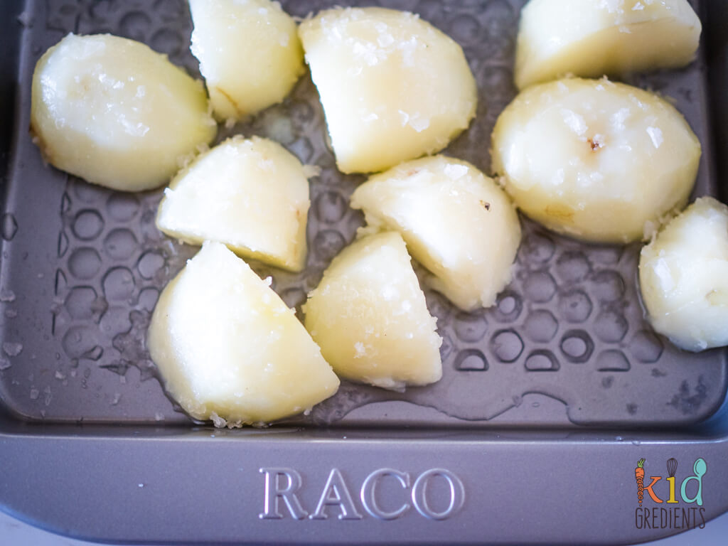 potatoes sitting on a tray with duck fat
