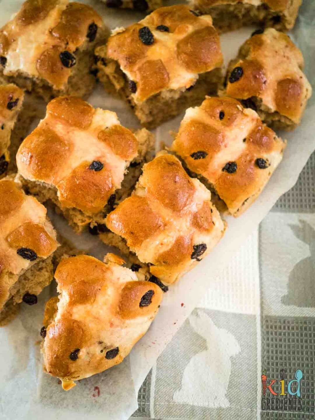 hot cross buns broken up on baking paper