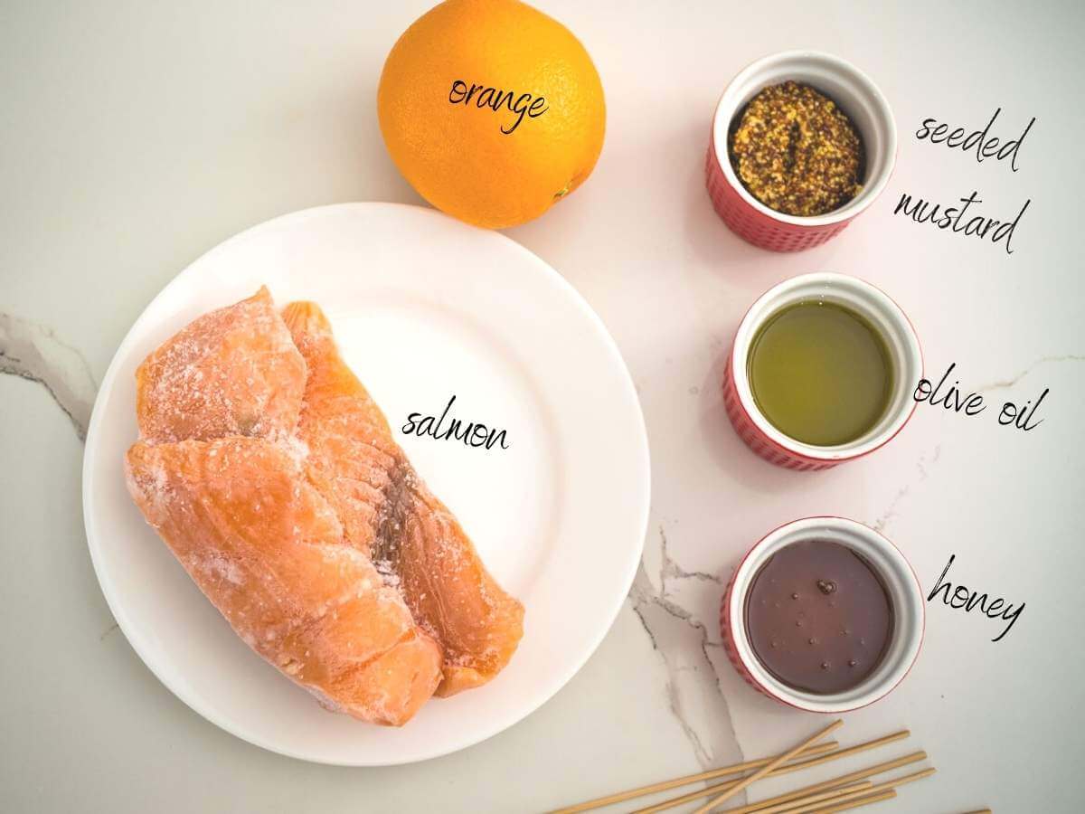 Ingredients for Salmon skewers with orange honey mustard glaze: salmon, honey, olive oil, orange and seeded mustard