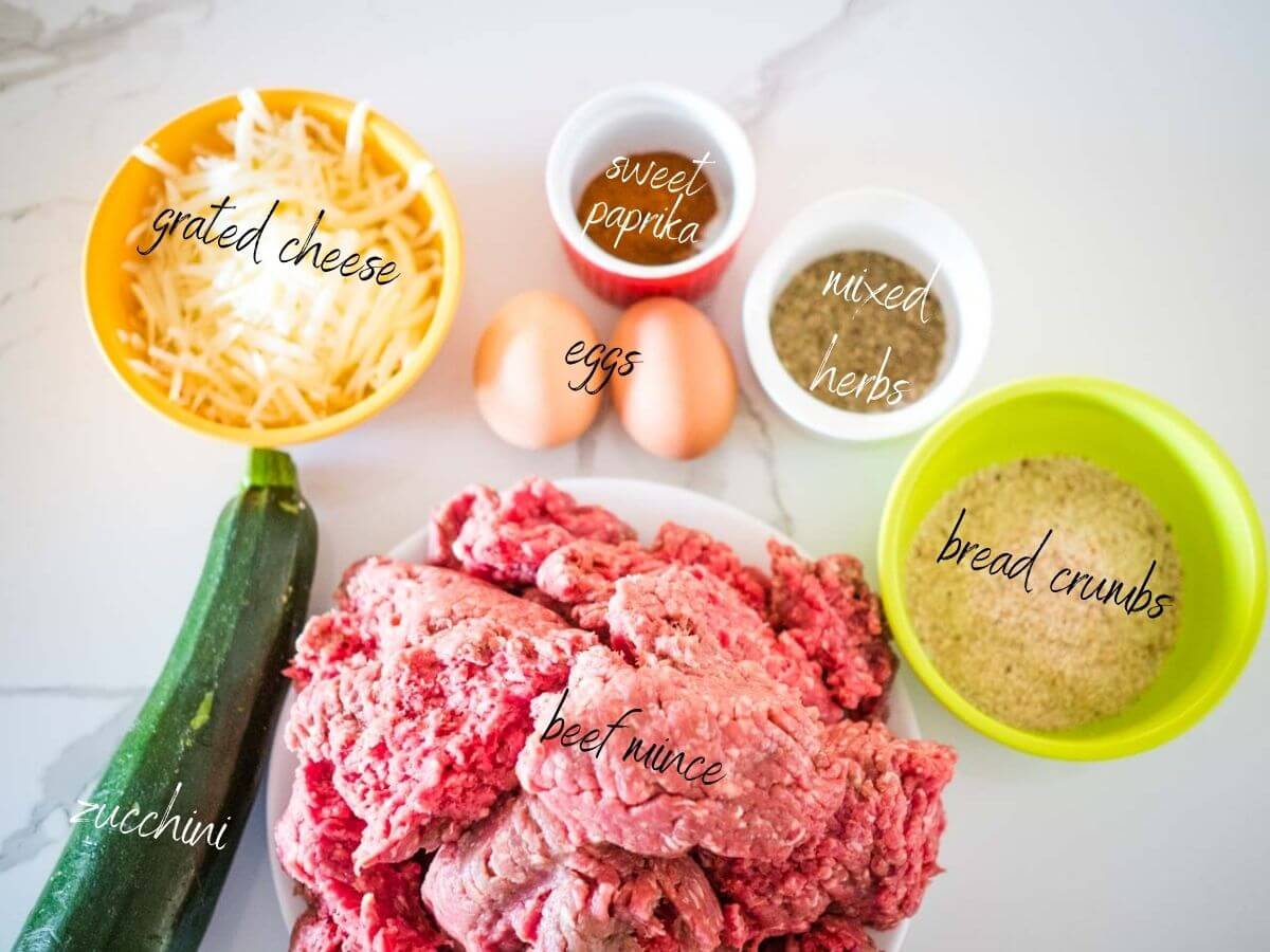 ingredients for yummy beef rissoles: beef mince, cheese, sweet paprika, mixed herbs, bread crumbs, eggs and zucchini