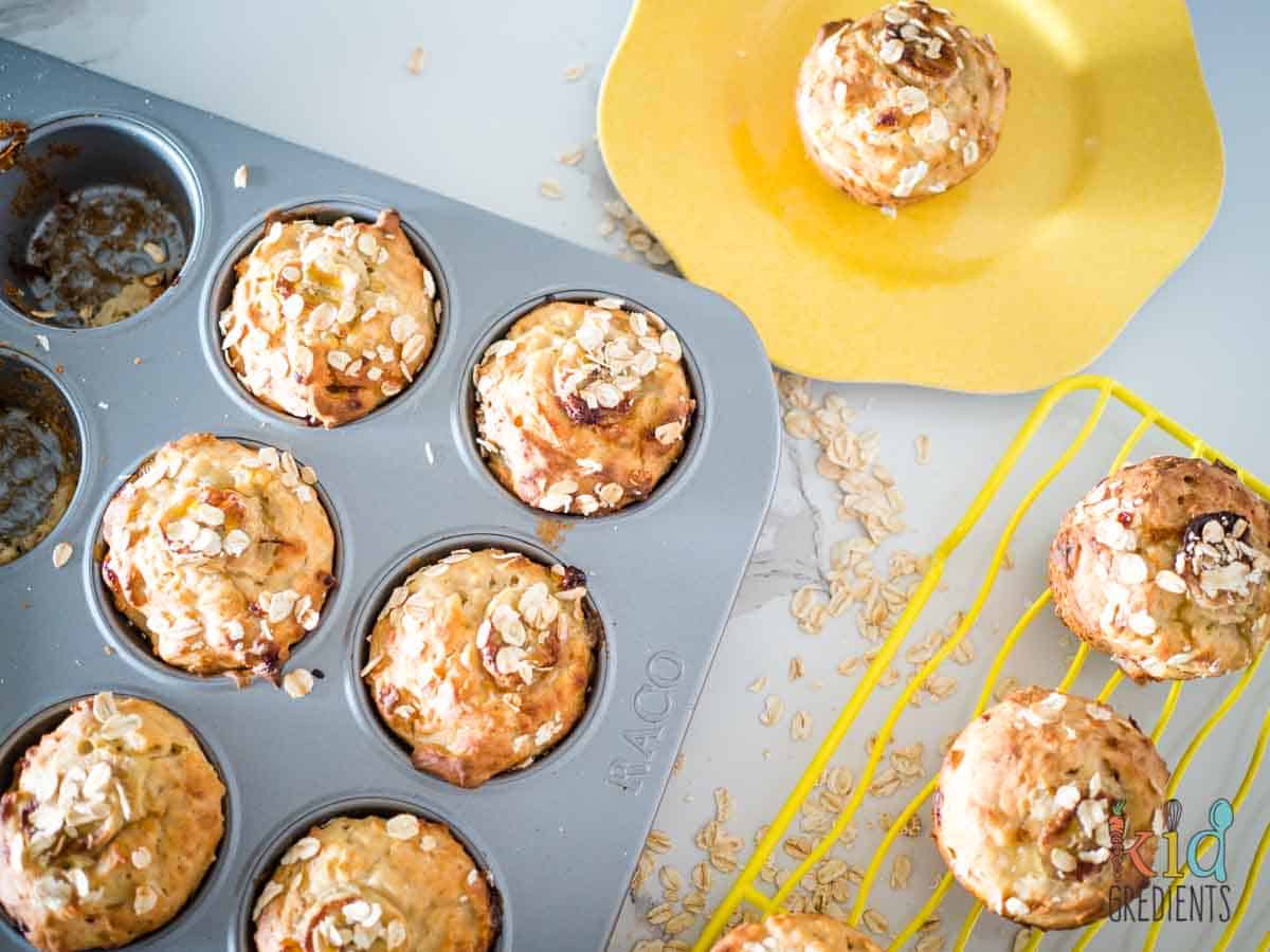 banana oat muffins in the muffin pan and on a cooling rack