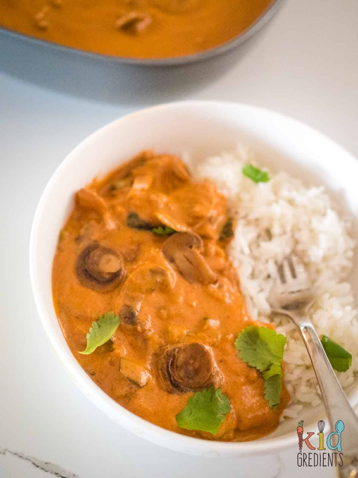Mushroom curry in a bowl with rice