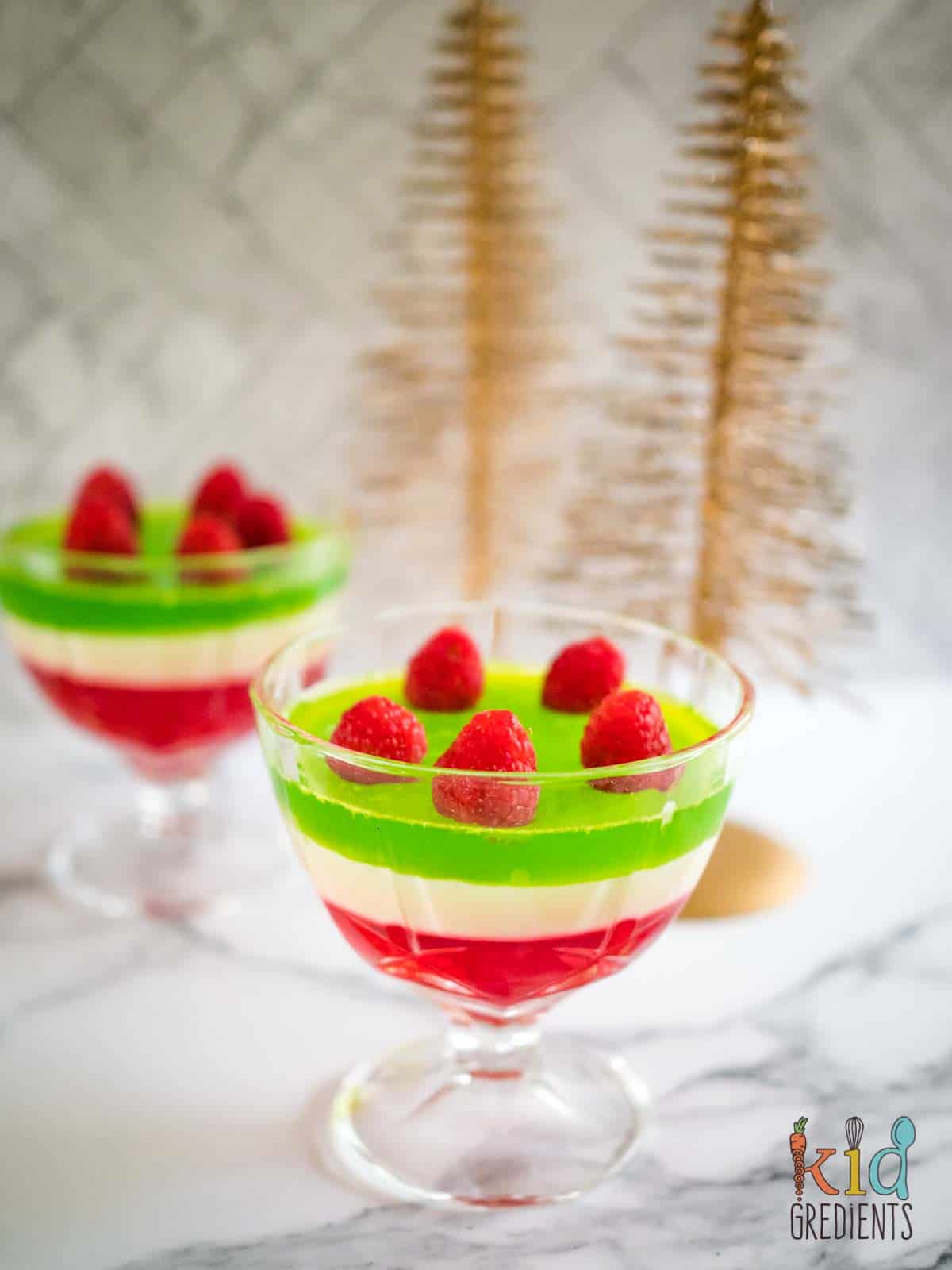 Layered jelly in glasses with raspberries on top