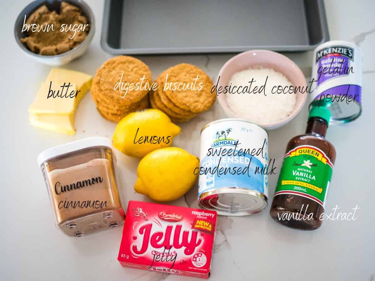 ingredients for jelly slice digestive biscuits, coconut, butter, brown sugar, cinnamon, vanilla extract, sweetened condensed milk, vanilla extract, gelatin, lemon juice, jelly