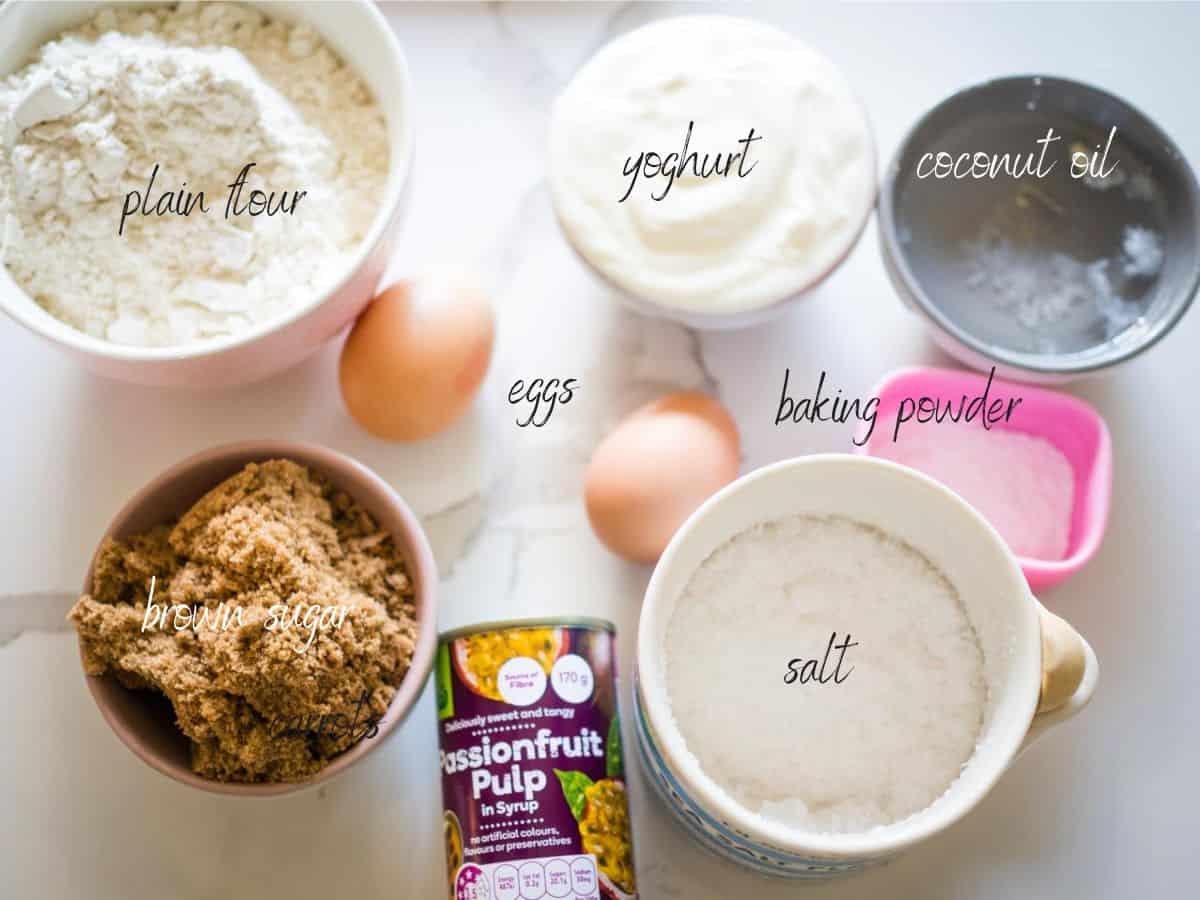 ingredients for passionfruit muffins: passionfruit, plain flour, baking powder, salt, brown sugar, eggs, coconut oil and yoghurt